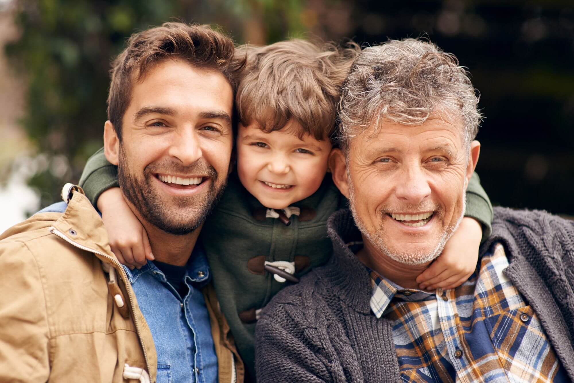 Shot of a grandfather, his adult son and grandson enjoying a day outdoors